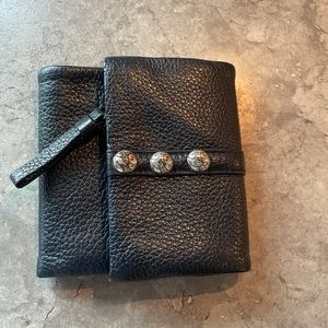 Navy blue leather trifold wallet.